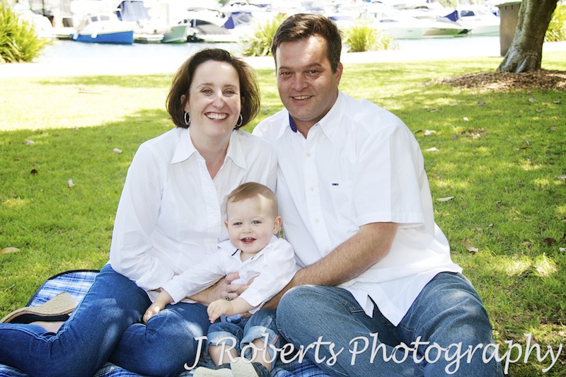 Parents sitting with their child - family portrait photography sydney